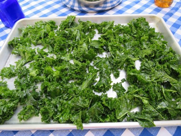 When making kale chips, spread the seasoned leaves in a single layer on a baking sheet to prevent sogginess