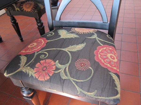 My parents helped me put art nouveau fabric (from a remnant I bought on eBay) on these cheap chairs I bought online.