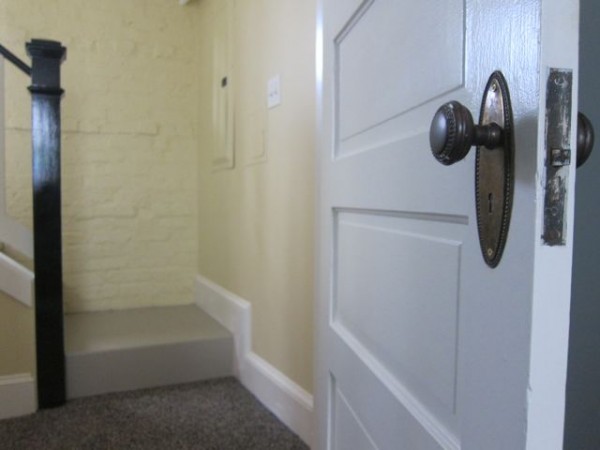 Basement renovation with salvaged antique beaded oval doorknobs and doors