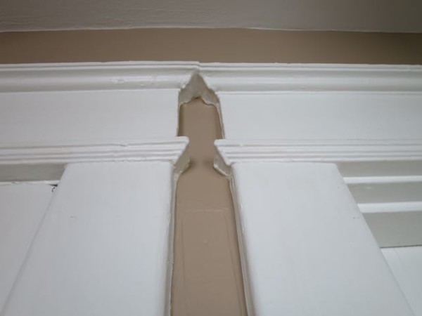 Reclaimed crown molding and other door and window trim is sturdy and has an old-world patina