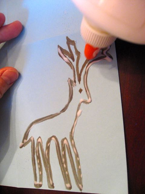 Draw a line of glue over any lines where you want to apply glitter.