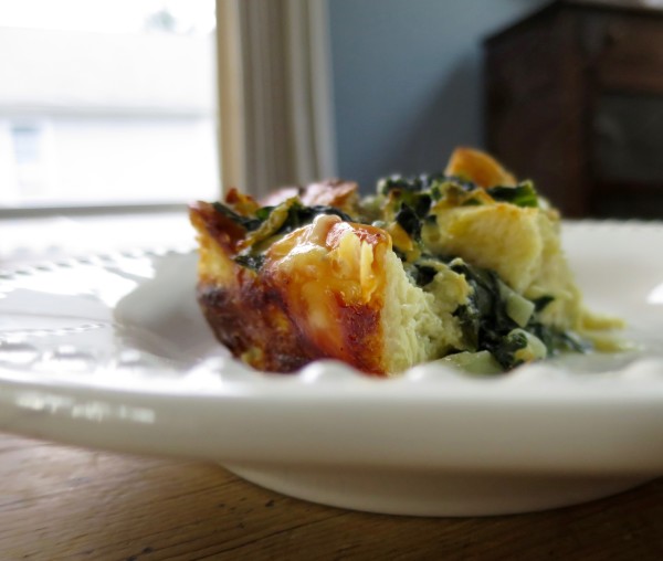 A slice of spinach and cheese strata, a make-ahead breakfast casserole